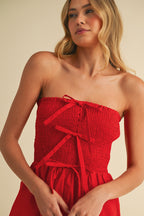 RED BOW-TIQUE SMOCKED ROMPER
