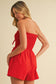 RED BOW-TIQUE SMOCKED ROMPER